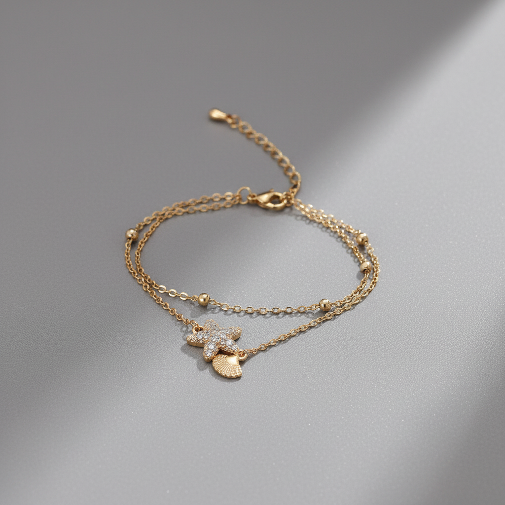 Ekrowl Marina-Shell: 18K Gold-Plated Pave Starfish & Fan-Shell Bracelet